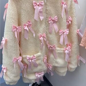 Dolls Kill Cream Sherpa Jacket with Pink Ribbon Bows